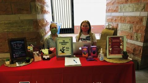ExtraVAGanza Project team members staff a distribution table at the UArizona Campus Pantry.